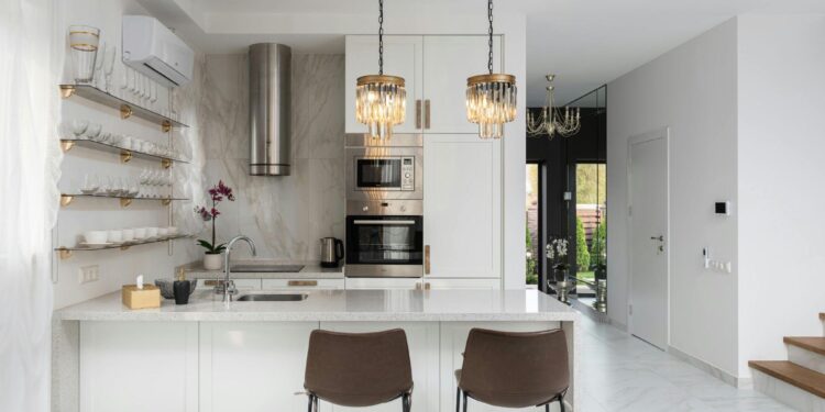 How to Choose the Right Marble Tile for Your Kitchen The heart of every home is the kitchen, which is fitting considering the kitchen is the first room most people buy new floors for, as it starts the vision for the room. Walking into a gazebo full of beautiful, extraordinary floors can feel like a marathon, which is the perfect starting point for remodeling a room. What tile works best for a busy family kitchen/entertainer's dream space? Unlike other rooms, like bathrooms and living rooms, there are different factors at play. Kitchens come with their own set of difficulties like heat, moisture, acidic foods, and inconsistent traffic. Because of that, this guide will help you with your cooking style, budget, and lifestyle. Assess Your Kitchen Lifestyle First Before falling in love with a slab of marble, ask yourself how you use your kitchen. Is there a daily cooking routine that creates a complex dish, which is paired with a recipe that includes lots of ingredients, and is it full of spills? Do you use a prepared dish? Is there a family running around, cooking and baking, or entertaining? Is it an empty nester, or a child-filled house? Maybe it is a kitchen that is used daily and prepped for an event with lots of traffic or even for a special use. Understanding your lifestyle will help define which type of marble will work best for your needs. Understanding Kitchen Zones Every kitchen has its own unique mess and wear zones and these zones do not always have the same exposure. Splash zones are the areas surrounding the sink and stove. These zones are places that need more damage resilient marble because these zones are more exposed to greasy water and acidic kitchen ingredients. Other zones that have low exposure to mess such as the sides of the island counters and kitchen walls are able to show more delicate marble options. Also remember that the sides of the fridges are areas that have high foot traffic and seats that are placed near the kitchen. A good rule of thumb is to consider the marble surrounding areas that people are likely to sit and spend time in. This is where the marble will need to look timeless and well kept. Marble Types for Kitchens In the kitchen, the marbled Carrara is the most frequently used type as it is budget friendly, and has a white background with a soft gray that helps hide water spots and small imperfections. Understanding different white marble tile variations helps you choose the best option for your specific needs. Calacatta is another marble but has a heftier price as it has a bold vein stating background making it high contrast. This is an unideal kitchen marble, however, as it will show water drops and crumbs if not taken care of. Statutory Carrara marble is the other kitchen alternative with a low vein white background but it will show imperfections. Casablanca Carrara is a suggested kitchen alternative as it has a warmer, cream color that is good for modern and traditional kitchens while also providing the beneficial features of light colorations. Best Applications in Kitchens Marble backsplashes and tile work in the kitchen add stunning visual interest with minimal upkeep. A beautiful white marble backsplash over the stove makes an elegant design statement. Marble also looks gorgeous on the sides of kitchen islands. It has low surface exposure when used over the island and makes a beautiful design contribution. Marble flooring in the kitchen is very beautiful but a complete flooring disaster in terms of maintenance and upkeep with constant foot traffic, dropped items, and tracked in dirt. Marble kitchen countertops are also gorgeous but one must be very committed to diligent upkeep in order to avoid the sight of a kitchen disaster. Choosing the Right Finish Marble looks stunning with a polished, shiny surface. However, polished marble hides dirt, fingerprints, and water spots, especially on kitchen surfaces. They take a lot of maintenance to keep looking clean. A more practical finish FOR kitchens is a honed surface which has a matte midrange finish. It doesn't show wear and tear as easily and is more forgiving, but is also duller. Marble with a leathered surface also has the added benefit of being more stain resistant, but isn't as dull. Overall, the finish you choose should depend on how frequently the kitchen is used and how often you want to clean. Color Coordination with Cabinets White cabinets paired with white marble need careful veining selection to create visual interest. Choose marble with medium to dramatic gray or gold veining that provides definition against cabinetry. Dark cabinets benefit from white marble tile as the light stone brightens the kitchen and creates striking contrast, while natural wood cabinets pair well with warm-toned marbles for honey or medium woods and cooler white marbles for darker walnut tones. Two-tone kitchens with mixed cabinet colors find marble serves as the perfect bridge material that ties disparate elements into cohesive design. Size and Pattern Selection Large format marble tiles measuring 12x24 inches or larger gives a sleek modern look with few grout lines. This works especially well for contemporary kitchens and small spaces, where the look can make the space feel more expansive. For backsplashes, classic subway tiles in 3x6 or 4x12 sizes are a timeless versatility and suit both traditional and transitional kitchen designs. Marble mosaic tiles work well for accent areas, like behind the range or in breakfast nooks. For vertical tile patterns, the eye is drawn to the ceiling, and can make it feel higher. Horizontal patterns can make a narrow kitchen feel more expansive. Lighting Considerations Natural sunlight enhances the details found within the marble. Colors and patterns appear vivid. Contrasting this with artificial lighting, the details found within the marble and the depth of veining are lost. To draw attention to the marble, under-counter LED lights are often used, and pendant lights suspended over counters create spotlight effects. Always ensure to get quartzite samples in your real kitchen to test at various times of the day, as samples in the showroom can deceive your expectations with your lighting conditions. Budget-Smart Marble Strategies Use marble where it will look best and alleviate maintenance worries- for example a stunning marble backsplash only works if you save money on marble-look porcelain floors. White marble tiles placed together to allow balanced design and savings. Mixing marble decoratively works with quartz countertops and porcelain tile floors. Total your dollars spent including professional installation, quality sealant, and maintenance product to include ownership costs for a decade. Maintenance Reality in Kitchens Marble in kitchens has a whole new set of challenges as you will need to work with constant acids including tomatoes and vinegar that will etch the surface. The kitchen marble will need to be sealed more often than other rooms, probably every 6 to 12 months. You will need to develop care habits like wipe spills and use cutting boards more often for it to last. Marble in kitchens characterizes over time, you will need to view this with a warm mindset rather than as damage. Common Kitchen Marble Mistakes When polished marble is installed in busy family kitchens, it can become slippery when wet, and it'll reveal every little scuff and mark. While a full marble approach may seem elegant, it's a nightmare to maintain multiple marble surfaces at a time. Ignoring grout color also skips the chance to show off the pattern or to create a seamless look. Choosing finishes based solely on aesthetics also misses the mark. The daily habits and style of cooking often conflict with the marble's sensitivity. Pristine, showroom perfect marble is a design kitchen's impossible dream, and an active kitchen is a setup for disappointment, so it's best to lean into the evolution of the marble. The Hybrid Approach Works Best Smart kitchen designs understand that mixing the materials is the best way to achieve the look of marble wherever it truly shines. Marble backsplashes with quartz countertops are absolutely gorgeous and eliminate the daily stress of maintaining marble work surfaces. Also, installing marble on the sides of the island and selecting a more durable porcelain for the floors is a perfect way to get the best of both worlds. This balanced method results in elegant and cohesive kitchens that look expensive and truly practical for everyday cooking. Making Your Final Decision Consider how you actually use your kitchen, and be honest with yourself about how much time and effort you can put into your marble kitchen countertop maintenance, as there is a commitment that will be required. Marble does have some pros and cons, which can be something you think about if you plan to sell your home within the next five years. Marble is something a lot of buyers either love and value for the aesthetic appeal, or hate and view as a liability. Marble is something you should love and enjoy every day, so be sure to choose a slab where the aesthetic is not just appealing for photos. Create Your Dream Kitchen How to Choose the Right Marble Tile for Your Kitchen